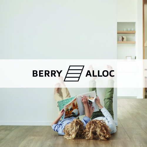 berry alloc logo imposed over a mother and child lying against a wall on a wooden floor