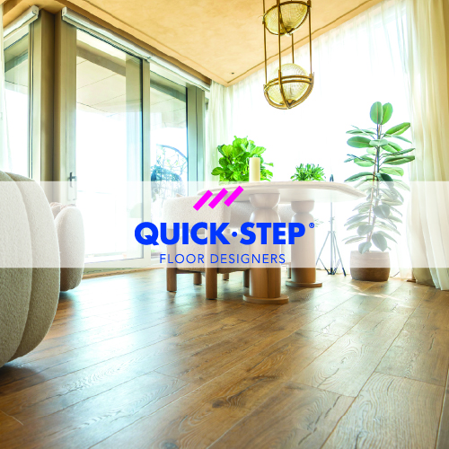 quick step logo imposed over living space with quick step luxury vinyl tile flooring
