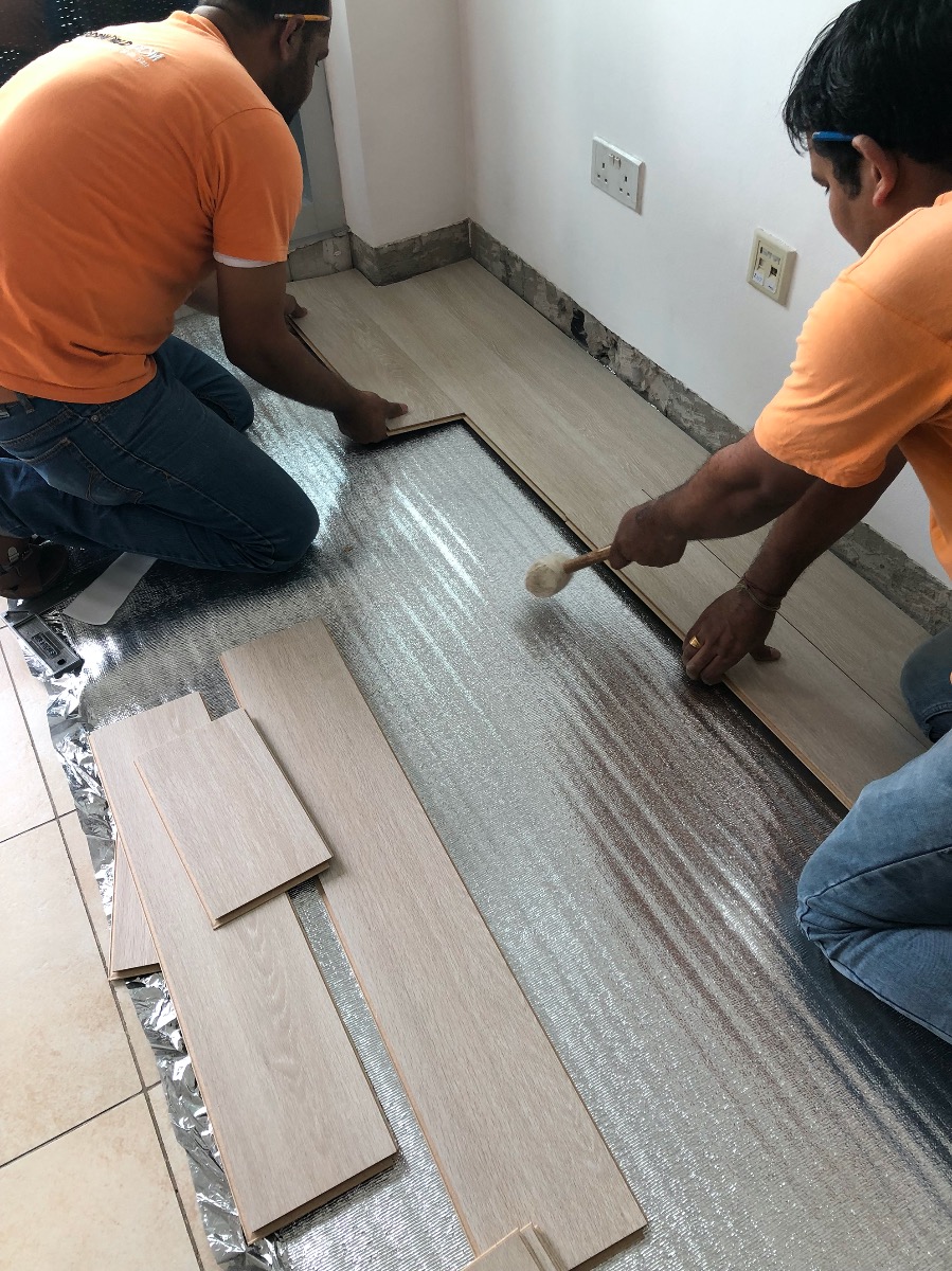 Floorworld team installing the laminated flooring