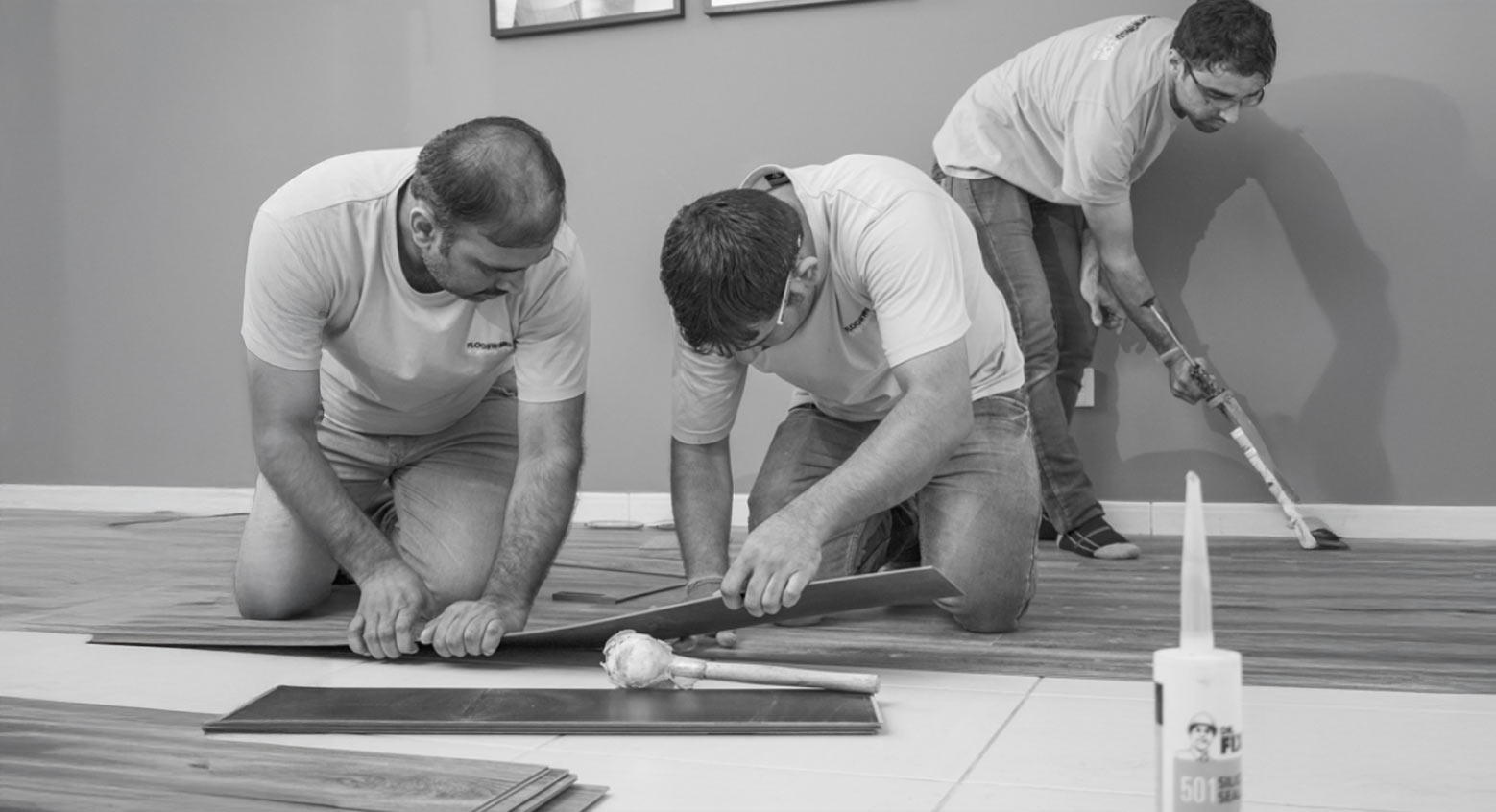 floorworld team members installing a wooden floor